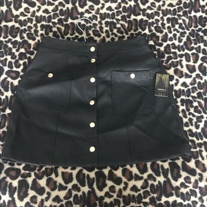 Black leather mini skirt with gold buttons